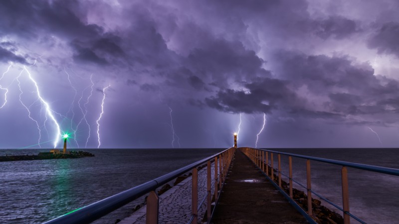 Port and lighthouse overnight storm with lightning in Port-la-Nouvelle in the Aude department in southern France. Maxime Raynal.